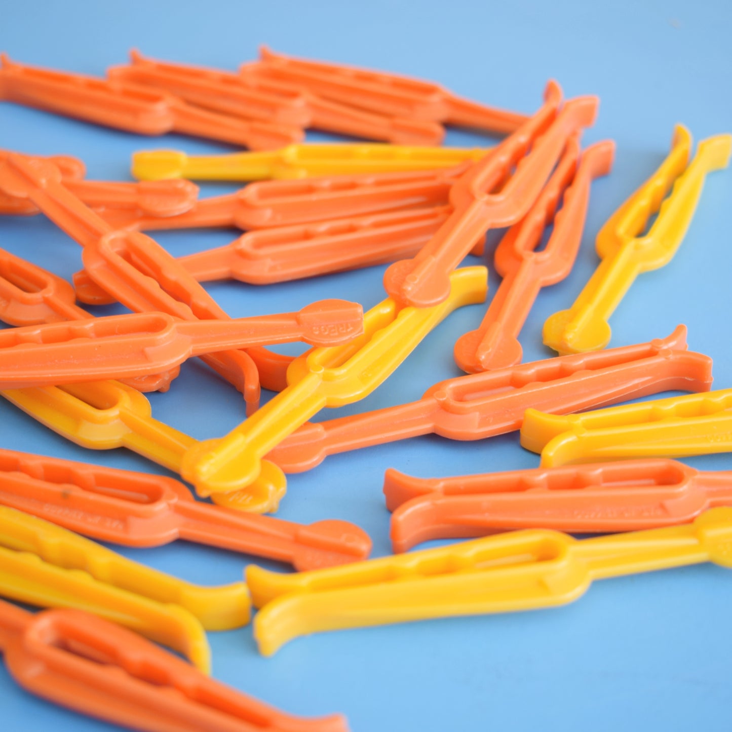 Vintage 1970s Plastic Clothes Pegs - Orange & Yellow