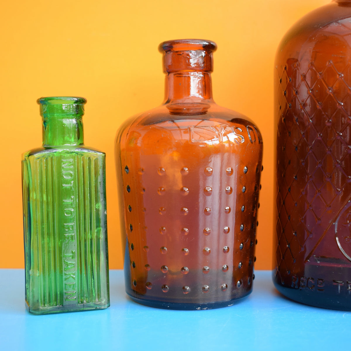Vintage 1920s Glass Poison Bottles - Emerald Green / Amber - Halloween Prop by Vintage