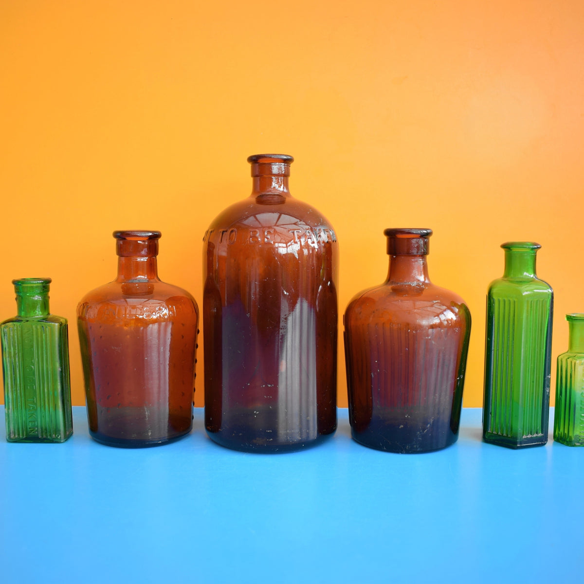 Vintage 1920s Glass Poison Bottles - Emerald Green / Amber - Halloween Prop by Vintage