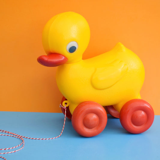 Vintage 1980s Plastic Yellow Duck With Red Wheels