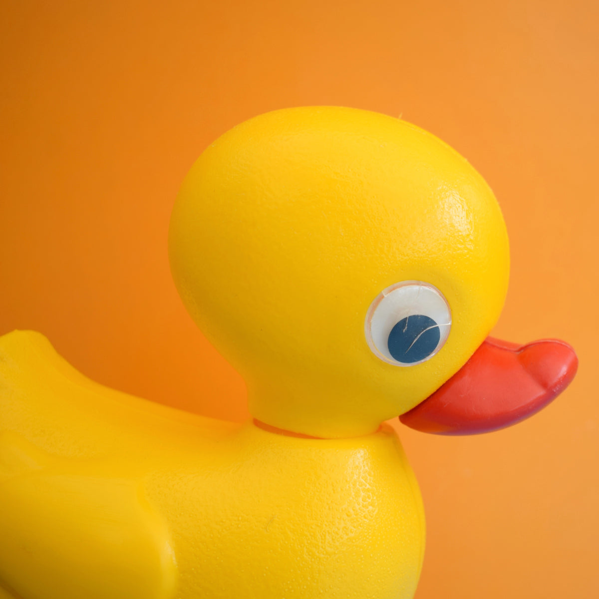Vintage 1980s Plastic Yellow Duck With Red Wheels