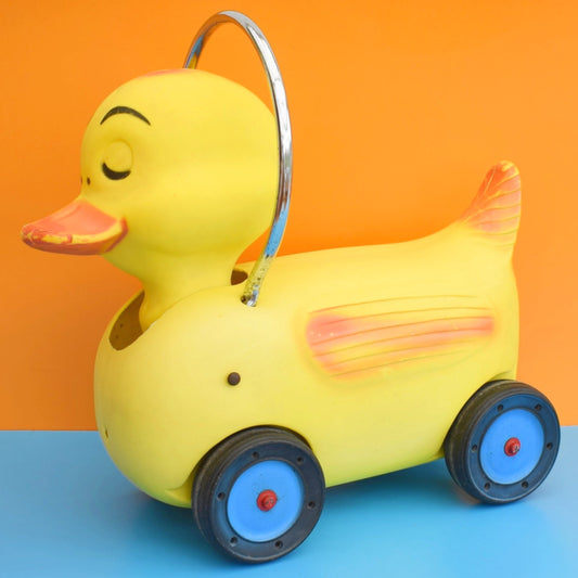 Vintage 1960s Kitsch Plastic Ride On Duck With Wheels - Yellow & Chrome .