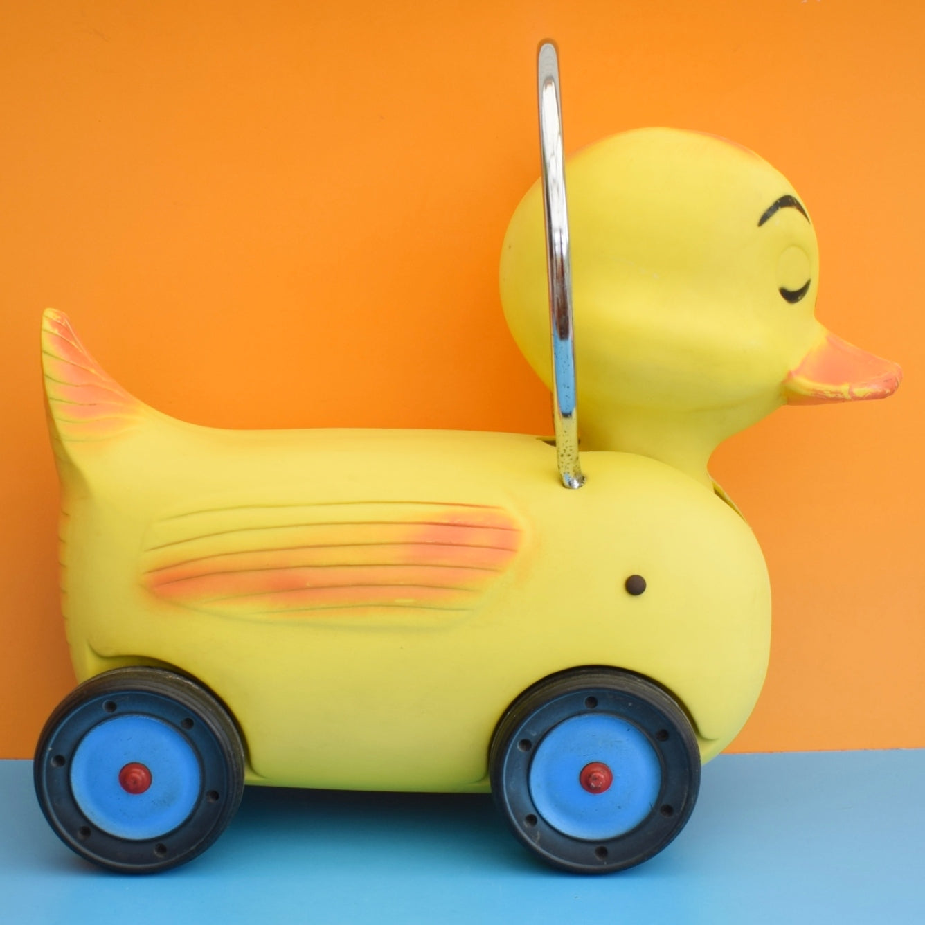 Vintage 1960s Kitsch Plastic Ride On Duck With Wheels - Yellow & Chrome .