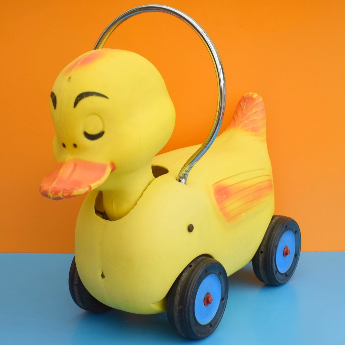 Vintage 1960s Kitsch Plastic Ride On Duck With Wheels - Yellow & Chrome .