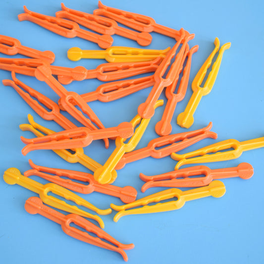 Vintage 1970s Plastic Clothes Pegs - Orange & Yellow by Vintage