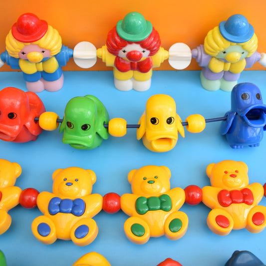 Vintage 1980s Plastic Pram Toys - Bright Colours