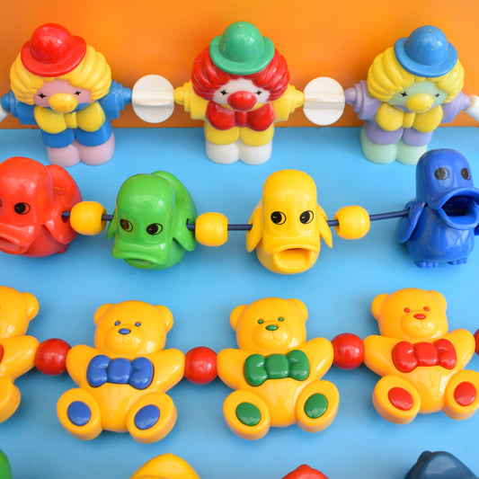 Vintage 1980s Plastic Pram Toys - Bright Colours by Pineapple Retro