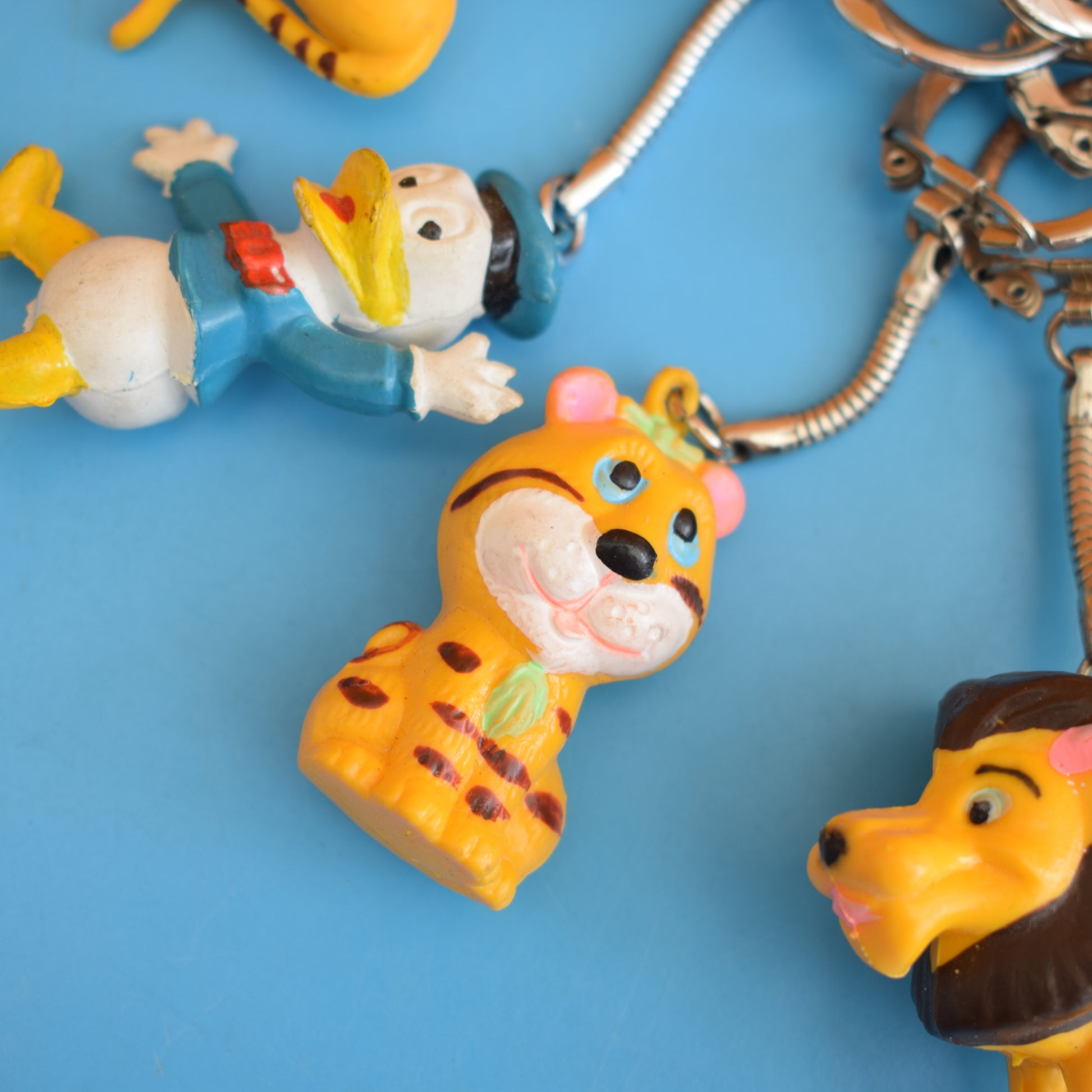 Vintage 1980s Mixed Keyrings - PacMan, Miniatures Etc by Pineapple Retro
