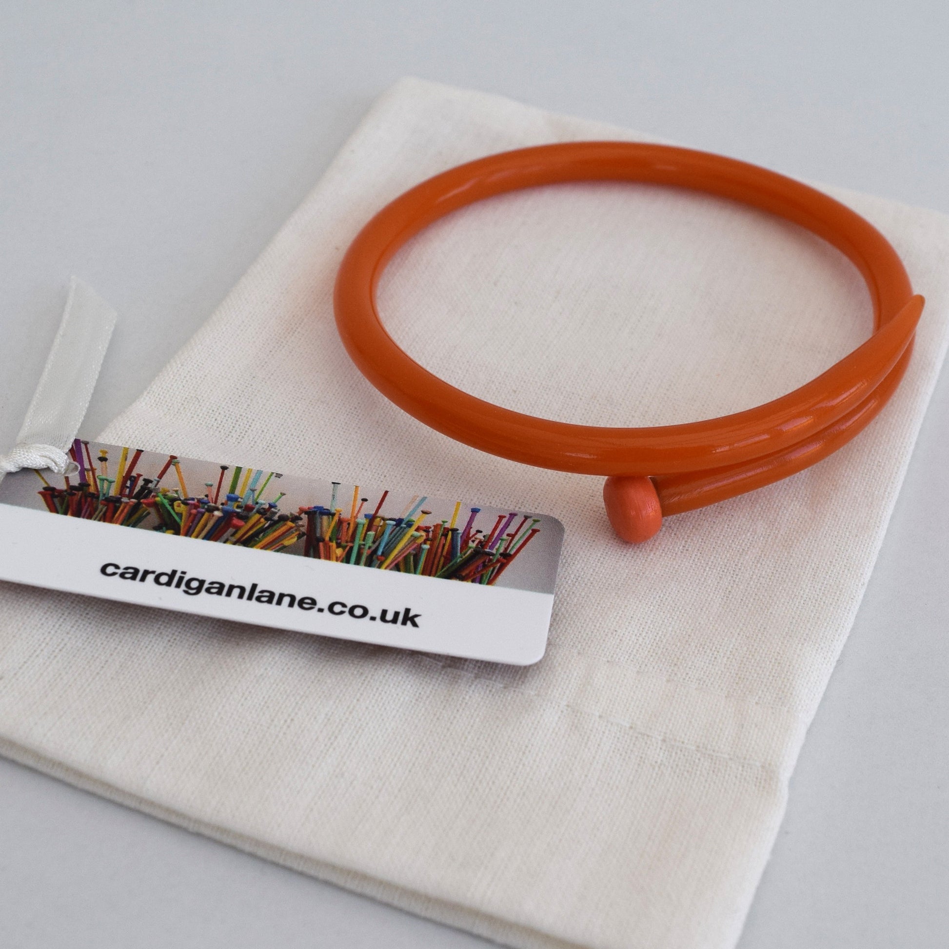 Retro Bangle by Cardigan Lane - Knitting Needle, Light Orange With Gift Bag